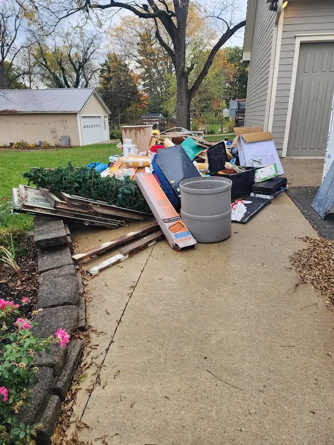 Dumpster being loaded with debris for Estate Cleanout Dumpster Rental in Chocolay